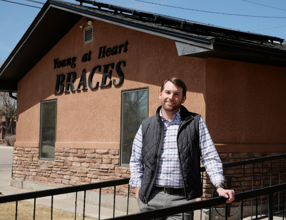 Dr. John Keating outside Young at Heart Affordable Braces